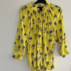 Yellow mock neck blouse with 3/4 sleeves and pleated ruffles